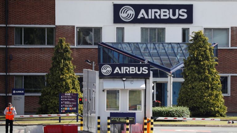 A security guard stands at the entrance to Airbus' wing assembly plant at Broughton, near Chester