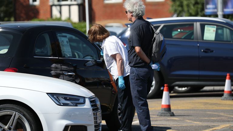 Customers at Motorpoint Chingford car dealer in north London, as car showrooms reopen to the public following the introduction of measures to bring England out of lockdown. PA Photo. Picture date: Monday June 1, 2020. See PA story HEALTH Coronavirus. Photo credit should read: Yui Mok/PA Wire..