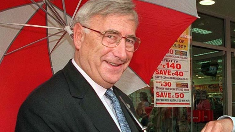 Stanley Kalms, Chairman of Dixons Group plc hands out strawberries to customers at their Oxford Street Store in London to celebrate the company's 60th birthday.  24/6/1997