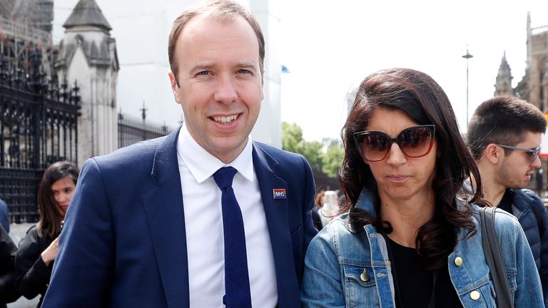 British Conservative party lawmaker Matt Hancock Secretary of State for Health and Social Care, leaves Parliament with an aide, in London, Friday, June 14, 2019. Hancock announced he has withdrawn from the Conservative Party leadership campaign to be the next British Prime Minister. (AP Photo/Alastair Grant)