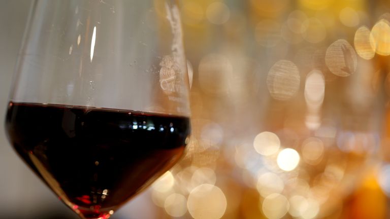 A glass of French red wine is displayed at the Chateau du Pavillon in Sainte-Croix-Du-Mont, France, July 29, 2019. 