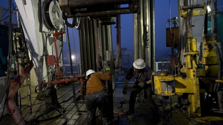  A floor crew pulls steel pipe out of a natural gas well on December 18, 2008 in the Barnett Shale of Fort Worth, Texas. 