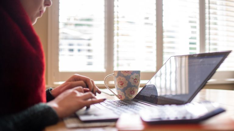 EMBARGOED TO 0001 FRIDAY APRIL 9 File photo dated 04/03/20 of a woman using a laptop on a dining room table set up as a remote office to work from home. Fewer than one in seven leaders in some of the UK's biggest companies have said they expect a full-time return to offices by the end of this year, according to a new survey. Issue date: Friday April 9, 2021.