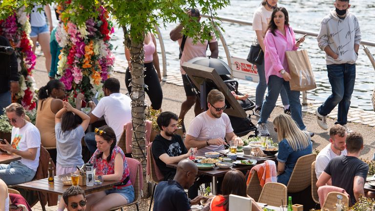 People enjoy the sun at outdoor restaurant tables in Kingston, London, as Bank Holiday Monday could be the hottest day of the year so far - with temperatures predicted to hit 25C in parts of the UK. Picture date: Monday May 31, 2021.