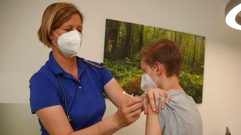 A child is given the Pfizer-BioNTech vaccine in the US. Pic: AP