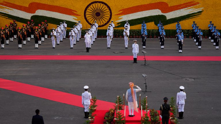 Indian Prime Minister Narendra Modi inspects a joint military guard of honor during Independence Day celebrations from the ramparts of the historic 17th century Red Fort in New Delhi, India, Sunday, Aug. 15, 2021. India commemorates its 1947 independence from British colonial rule on Aug. 15. (AP Photo/Manish Swarup)