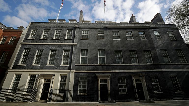 The facades of number 10, right, and number 11 Downing Street are seen in London, Tuesday, April 27, 2021. British Prime Minister Boris Johnson has denied a press report which quoted him as allegedly saying he would rather see "bodies pile high in their thousands" than impose a third national lockdown on the country. Media reports have claimed that Johnson made the comment in the fall of 2020, when his government imposed a second lockdown to combat a surge in coronavirus cases. (AP Photo/Matt Du