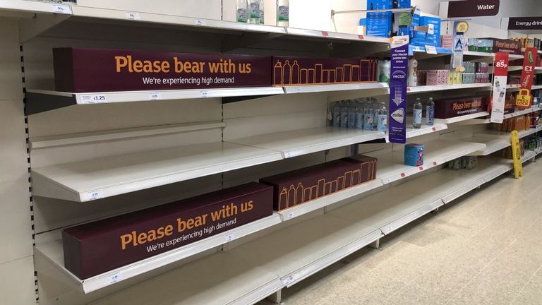 Empty shelves and signs on the soft drinks aisle of a Sainsbury's store in Blackheath, Rowley Regis in the West Midlands. Supermarkets have urged customers not to panic buy in response to reports of emptying shelves, saying they are continuing to receive regular deliveries. The UK's biggest supermarkets described any shortages as 