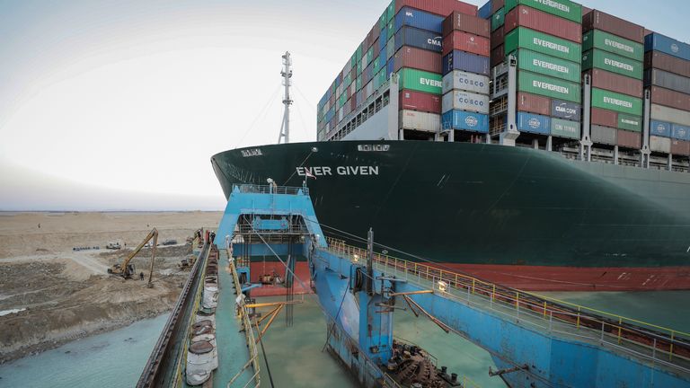 HANDOUT - 28 March 2021, Egypt, Suez: Naval dredger "Mashhour" takes part in the refloating operation carried out to free the "Ever Given", a container ship operated by the Evergreen Marine Corporation, which is currently stuck in the Suez Canal. The pressure is mounting on Egypt to dislodge the Panama-flagged massive container ship which has blocked the Suez Canal since Tuesday, as more shipping firms are rerouting their vessels away from the waterway. Photo by: -/picture-alliance/dpa/AP Images