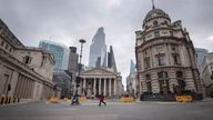 A woman walks through a deserted Bank junction in the City of London as the UK continues in lockdown to help curb the spread of the coronavirus 30/3/20