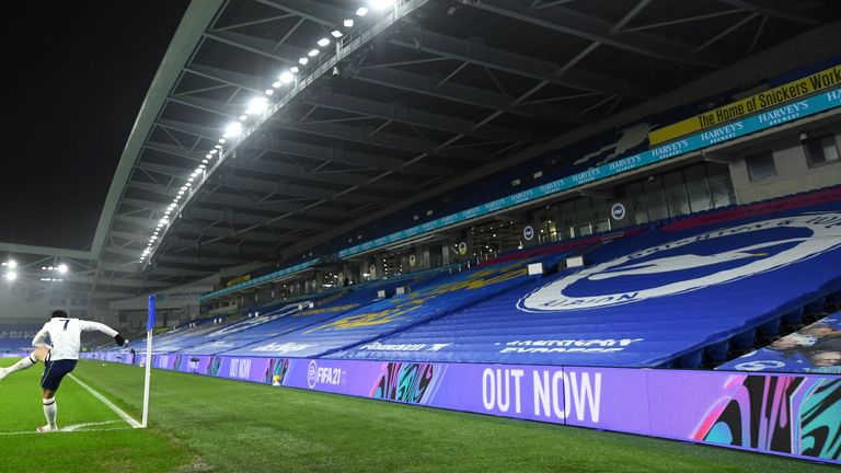 Tottenham Hotspur's Son Heung-min takes a corner in front of the empty stands during the Premier League match at the AMEX Stadium, Brighton. Picture date: Sunday January 31, 2021.