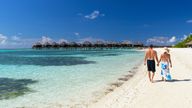 Couple on beach at Olhuveli Beach and Spa Resort, South Male Atoll, Kaafu Atoll, Maldives -
 