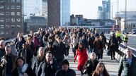 Commuters crossing London Bridge, in central London, during the morning rush hour prior to lockdown