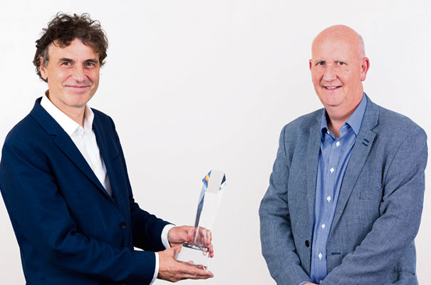 Professor Florin Udrea (left) receives the Cambridge Enterprise Academic Entrepreneur of the Year award from Paul Seabright of Cambridge Enterprise.