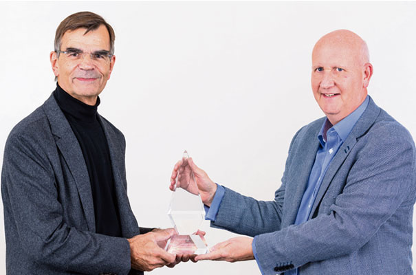 Professor Steve Young receives the Cambridge Enterprise Lifetime Achievement Award from Paul Seabright of Cambridge Enterprise.