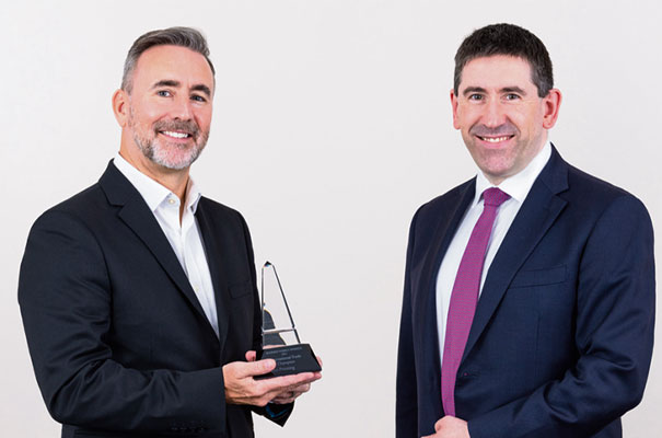 Domino Printing Sciences UK operations director Carl Haycock (left)is presented with the International Trade award by Stephen Ainsworth, Barclays.