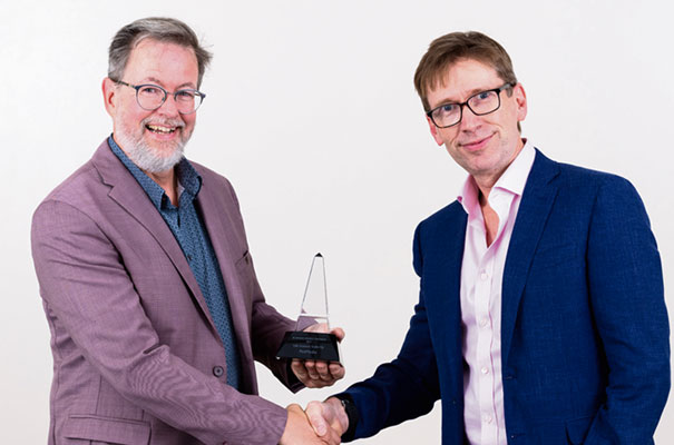 Dr Tom Weaver, CEO of PetMedix (left) is awarded the Life Science Scale-up of the Year award by Robert Tansley of Cambridge Innovation Capital.