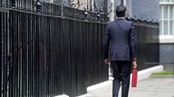 Chancellor of the Exchequer Rishi Sunak carries his ministerial 'Red Box' as he leaves 11 Downing Street before delivering his budget