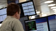 Traders looks at financial information on computer screens on the IG Index trading floor in London, Britain February 6, 2018.