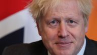 Britain's Prime Minister Boris Johnson sits in front of a Union flag as he talks with Abu Dhabi's Crown Prince Sheikh Mohammed bin Zayed al-Nahyan inside 10 Downing Street in central London on December 10, 2020. (Photo by Gareth Fuller / POOL / AFP) (Photo by GARETH FULLER/POOL/AFP via Getty Images)