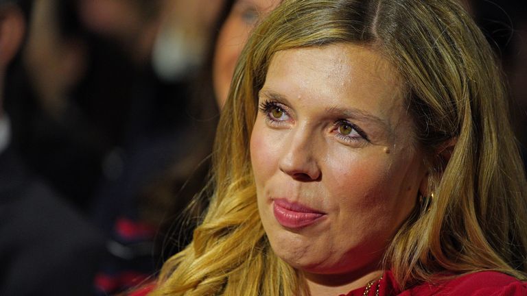 Prime Minister Boris Johnson's wife Carrie watches as he delivers his keynote speech at the Conservative Party Conference in Manchester. Picture date: Wednesday October 6, 2021.