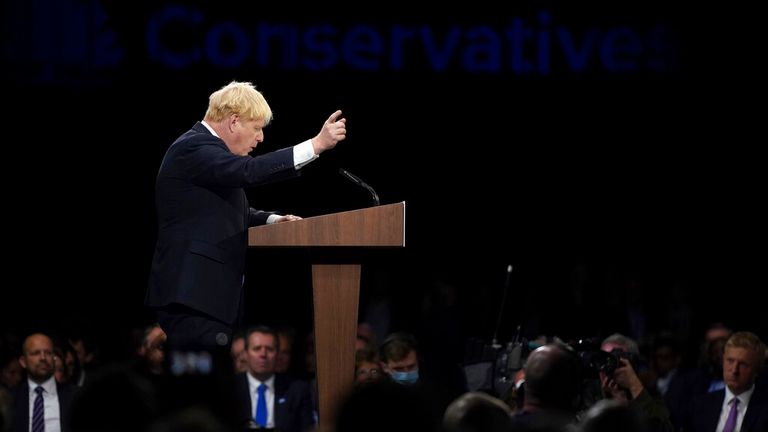 Britain's Prime Minister Boris Johnson gestures as he makes his keynote speech at the Conservative party conference in Manchester