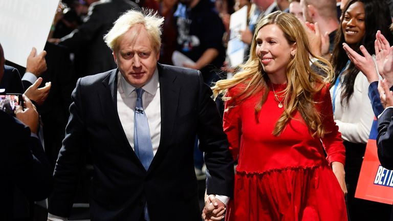 Britain's Prime Minister Boris Johnson departs with his wife Carrie Johnson after delivering a speech during the annual Conservative Party Conference, in Manchester, Britain, October 6, 2021. REUTERS/Toby Melville
