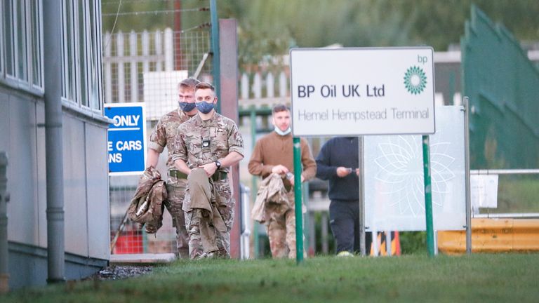 Members of the military walk at Buncefield Oil Depot in Hemel Hempstead, Britain, October 4, 2021. REUTERS/Andrew Boyers
