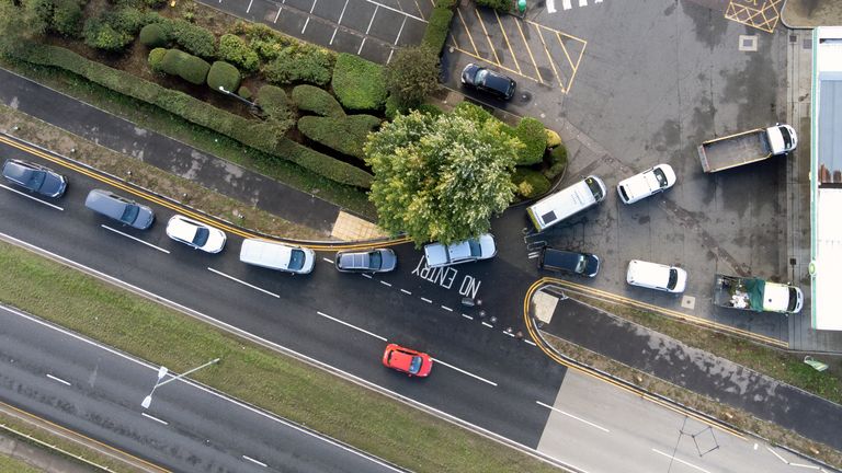 People queue for fuel at a petrol station in Hemel Hempstead. Picture date: Monday October 4, 2021.