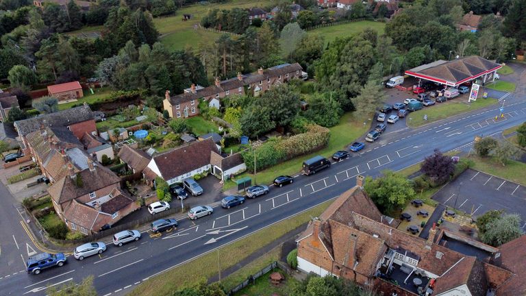 Motorists queue for fuel at an Esso petrol station in Ashford, Kent. Picture date: Monday October 4, 2021.