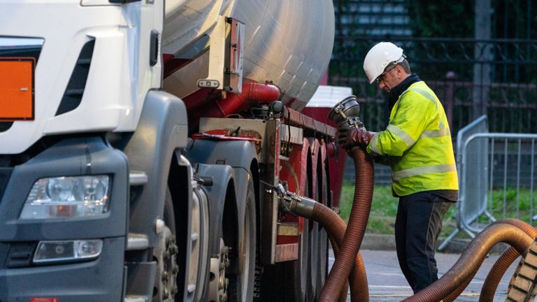 A tanker driver makes a fuel delivery at a petrol station in south London. Picture date: Monday October 4, 2021.