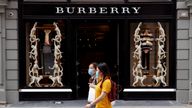 People wearing protective masks walk past a Burberry store at Covent Garden, following the outbreak of the coronavirus disease (COVID-19) in London, Britain June 15, 2020.