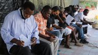 People register for the Moderna vaccine in Haiti where doses were donated by the US through the UN's COVAX system