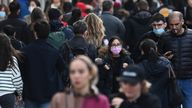 Shoppers, some wearing masks, walk along Oxford Street amidst the spread of the coronavirus disease (COVID-19) pandemic, in London, Britain, October 20, 2021. REUTERS/Toby Melville