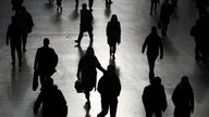 Commuters walk through Waterloo station during rush hour, as the number of Coronavirus cases grow around the world, in London, Britain, March 17, 2020. REUTERS/Hannah McKay