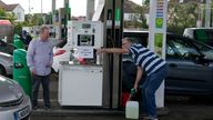 A man filled up a canister at a busy petrol station in London, Monday, Oct. 4, 2021. British military personnel have begun delivering fuel to gas stations after a shortage of truck drivers disrupted supplies for more than a week, leading to long lines at the pumps as anxious drivers scrambled to fill their tanks. (AP Photo/Frank Augstein)
PIC:AP