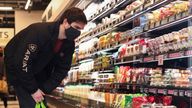 FILE PHOTO: A customer looks at the products at the UK's first Amazon Fresh supermarket, in London, Britain March 4, 2021. REUTERS/Henry Nicholls/File Photo