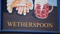  A Wetherspoon's logo is seen at a pub in central London