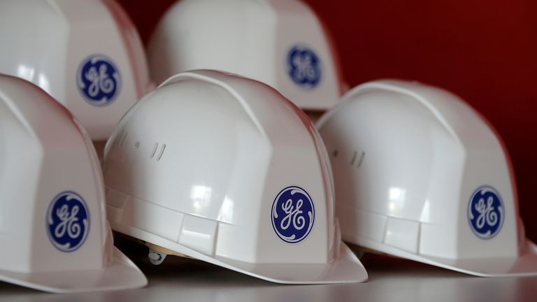 FILE PHOTO: The General Electric logo is pictured on working helmets during a visit at the General Electric offshore wind turbine plant in Montoir-de-Bretagne, near Saint-Nazaire, western France, November 21, 2016. REUTERS/Stephane Mahe/File Photo