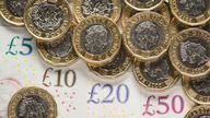 EMBARGOED TO 0001 MONDAY JULY 29 File photo dated 26/01/18 of bank notes and coins. The national living wage has helped increase the pay of self-employed workers even though they are not entitled to receive it, a new study suggests.