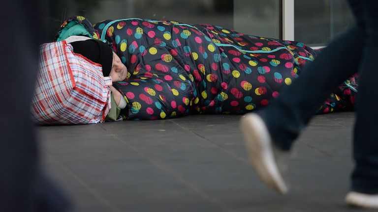 EMBARGOED TO 0900 TUESDAY JULY 27 File photo dated 16/01/20 of people walking past a homeless man in London. The Kerslake Commission on Homelessness and Rough Sleeping is calling for the Government to maintain the additional funding it made available during the coronavirus pandemic - an estimated extra £82 million a year. Issue date: Tuesday July 27, 2021.