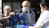 Pime Minister Boris Johnson plays Connect 4 with resident Janet (left) and carer Lakshmi during a visit to Westport Care Home in Stepney Green, east London, ahead of unveiling his long-awaited plan to fix the broken social care system. Picture date: Tuesday September 7, 2021.
Paul Edwards/The Sun/PA Wire/PA Images