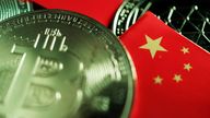 FILE PHOTO: A Chinese flag is seen among representations of Bitcoin and other cryptocurrencies in this illustration picture taken June 2, 2021. REUTERS/Florence Lo/Illustration/File Photo
