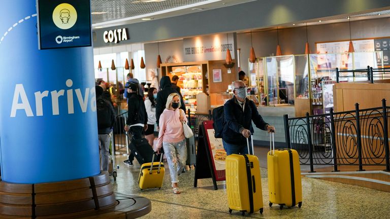 Passengers arriving at Birmingham Airport, as forty-seven countries were removed from the red list, meaning arrivals from those locations will no longer need to spend 11 nights in a quarantine hotel. Picture date: Monday October 11, 2021.