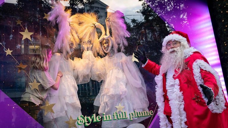 A man dressed as Santa Claus outside Selfridges in London as the department store unveils its Christmas windows on Oxford Street. This year's display is themed around 'Christmas of Dreams'. Picture date: Thursday October 28, 2021.