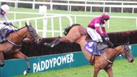 Outlander ridden by Bryan Cooper (right) leads Pont Alexandre ridden by Ruby Walsh over the last fence before winning the Flogas Novice Chase during the Ir