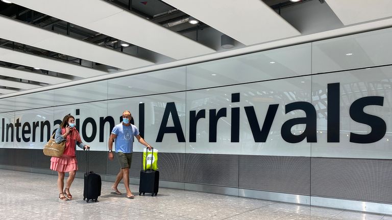 Passengers from international flights arrive at Heathrow Airport, following the outbreak of the coronavirus 