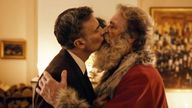 Harry and Santa finally kiss after seemingly falling for each other over a series of annual festive meetings. Pic: Posten