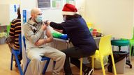 People receive coronavirus disease (COVID-19) vaccines at the Sovereign Harbour Community Centre on Christmas Day in Eastbourne, Britain, December 25, 2021. REUTERS/Hannah McKay
