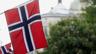 Norwegian flags flutter at Karl Johans street in Oslo, Norway, May 31, 2017